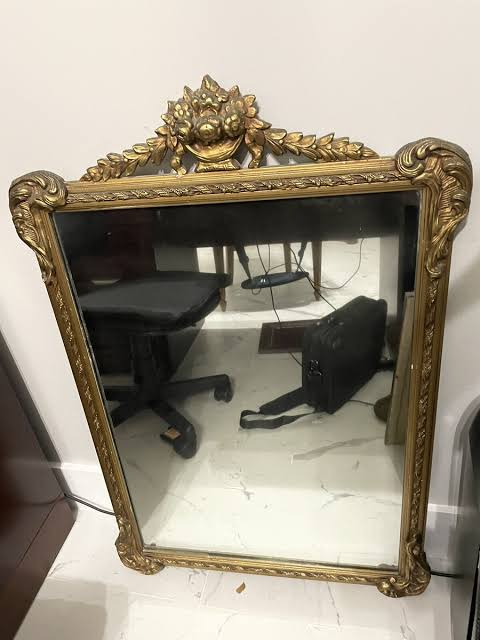 Ornate vintage mirror with original gold framing